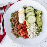 The Cobb Salad · bacon, egg, avocado, blue cheese crumbles, cucumber, tomato - we suggest white balsamic vina...