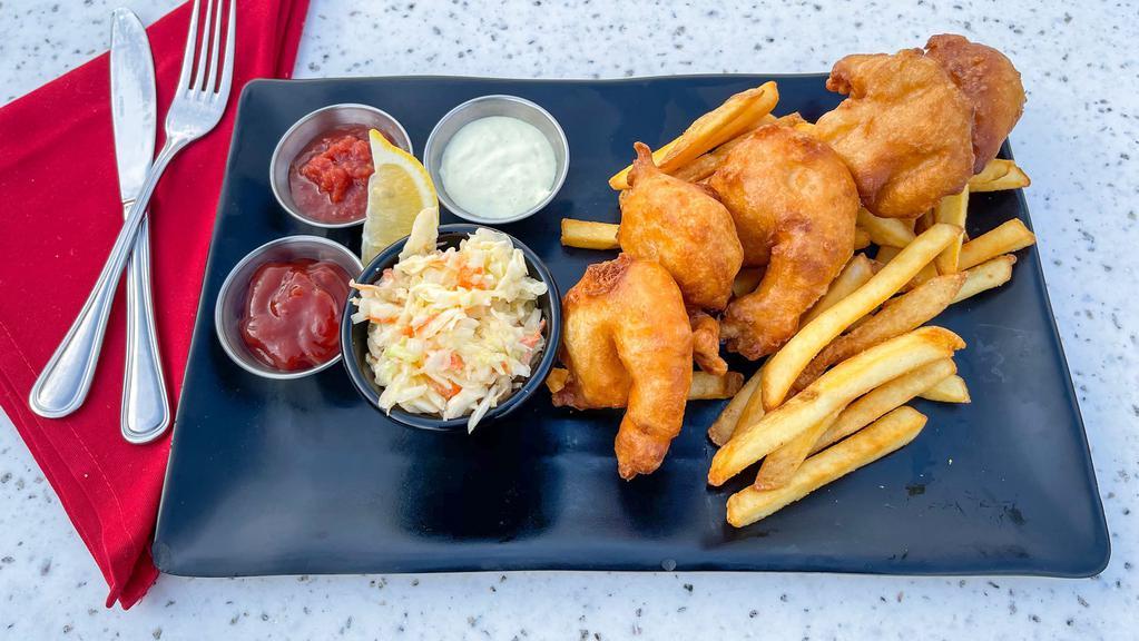 Beer Battered Pacific Prawns · made with stone's house blonde ale and served with french fries and coleslaw and ketchup, house cocktail sauce and house tartar sauce