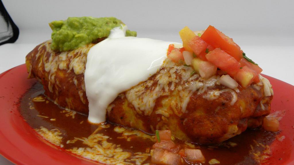 Star Burrito  · Meat Rice Beans topped with enchilada sauce Cheese guacamole sour cream & Salsa