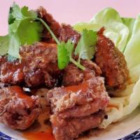 Sticky Pork Ribs · Deep fried baby pork ribs with tamarind chili sauce