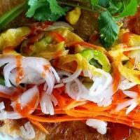 Chicken Curry Taco · Braised chicken yellow curry on roti bread