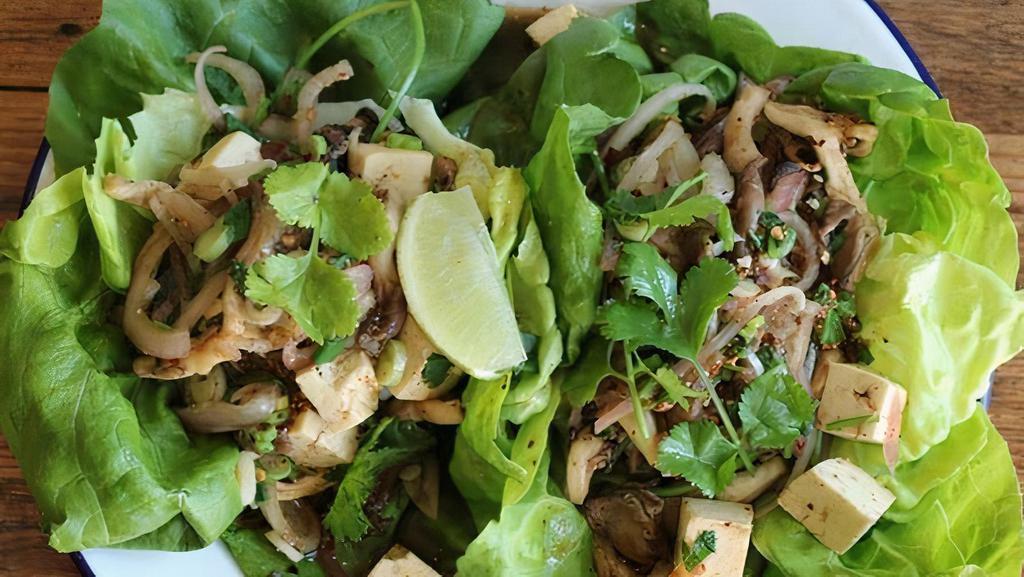 Larb Salad · with chili, shallots, cilantro, scallions, mint, roasted rice powder, fresh lime juice, butter lettuce cups.