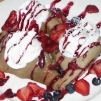 Icelandic Pancakes · Thin crepes, served cold with mixed berries, raspberry sauce and whipped cream.