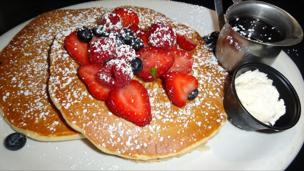 Mixed Berry Pancakes · Filled and topped with fresh berries.