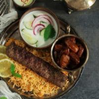 Beef Kabab Meal (Rice & Salad) · Fresh off the grill Beef skewers served on a bed of rice with a side salad.