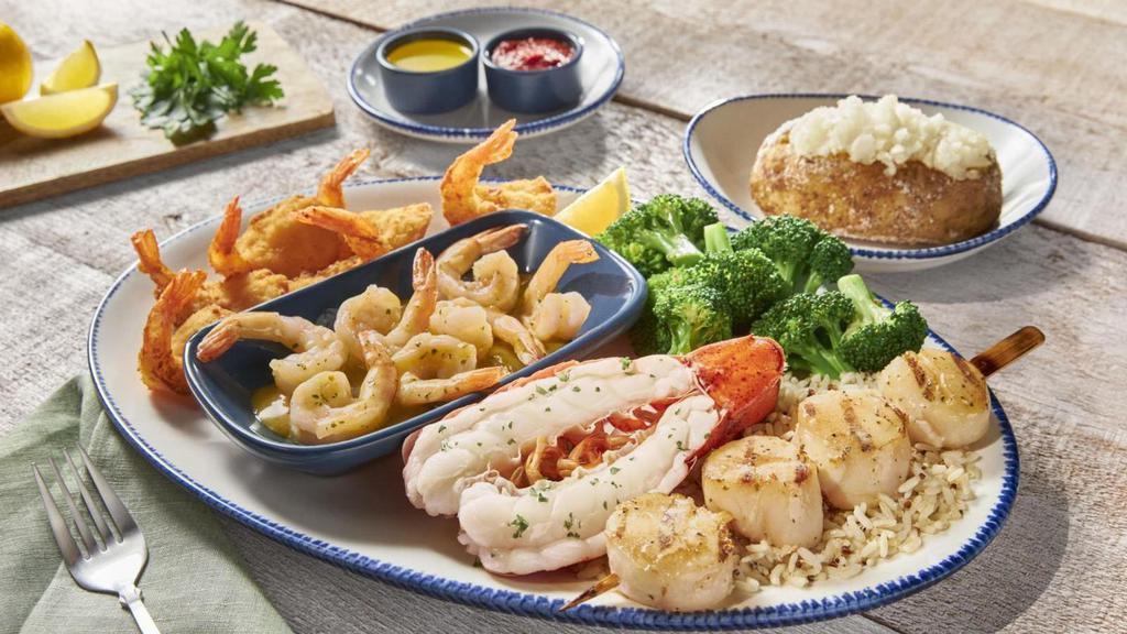 Seafarer'S Feast · A broiled Maine lobster tail, grilled sea scallops, garlic shrimp and Walt’s Favorite Shrimp. Served with choice of two sides.. 1220 Cal