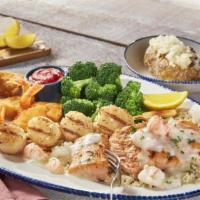 New! Mariner'S Feast** · Atlantic salmon** topped with creamy langostino and
Maine lobster sauce, grilled sea scallop...