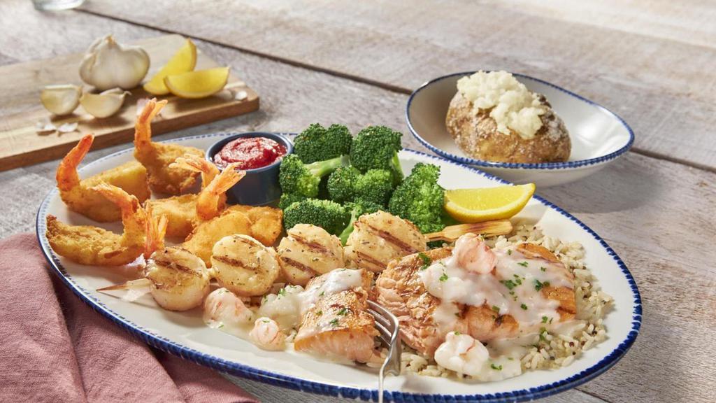 New! Mariner'S Feast** · Atlantic salmon** topped with creamy langostino and
Maine lobster sauce, grilled sea scallops and
Walt’s Favorite Shrimp. Served with choice of two sides.. 1050 Cal