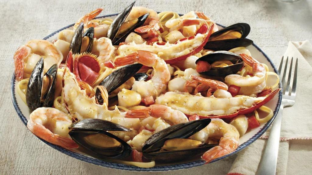 Bar Harbor Lobster Bake · Petite Maine lobster tails, split and roasted, with shrimp, bay scallops, mussels and fresh tomatoes. Served over linguini in a garlic and white wine broth.. 1100 Cal