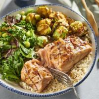 Sesame-Soy Salmon** Bowl · Soy-ginger-glazed Atlantic salmon, crispy Brussels
sprouts, quinoa rice, edamame, spring mix...