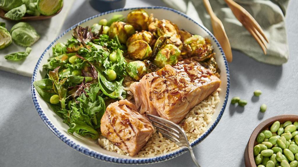 Sesame-Soy Salmon** Bowl · Soy-ginger-glazed Atlantic salmon, crispy Brussels
sprouts, quinoa rice, edamame, spring mix and crispy
onions with sesame vinaigrette.. 880 Cal