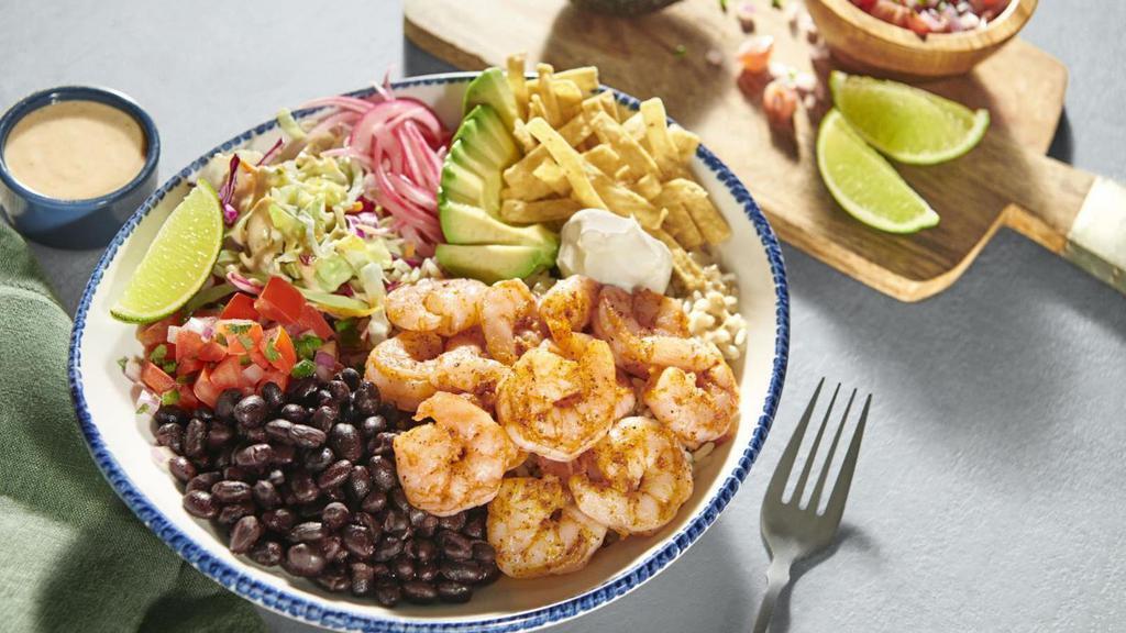 Baja Shrimp Bowl · Seasoned shrimp, avocado, black beans, jasmine rice, red onion, crunchy slaw, pico de gallo, sour cream and tortilla strips with jalapeño ranch.. 1140 Cal