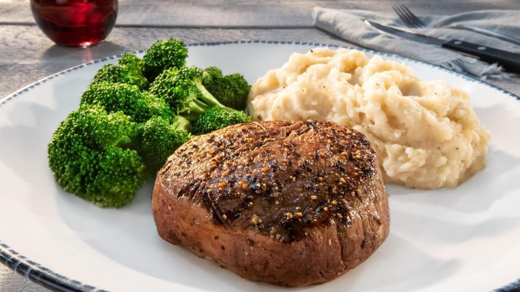 6 Oz. Filet Mignon** · Simply grilled with a peppercorn seasoning. Served with choice of two sides.. 270 Cal