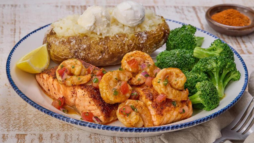 Today'S Catch - Salmon New Orleans** (Full) · Blackened Atlantic salmon topped with shrimp tossed in a Cajun butter sauce, with tomato-cilantro relish. Served with lemon and choice of two sides.. 890 Cal