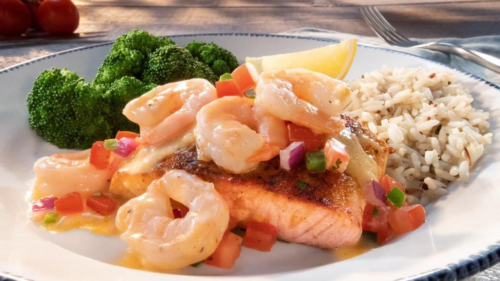 Today'S Catch - Salmon New Orleans** (Half) · Blackened Atlantic salmon topped with shrimp tossed in a Cajun butter sauce, with tomato-cilantro relish. Served with lemon and choice of two sides.. 580 Cal