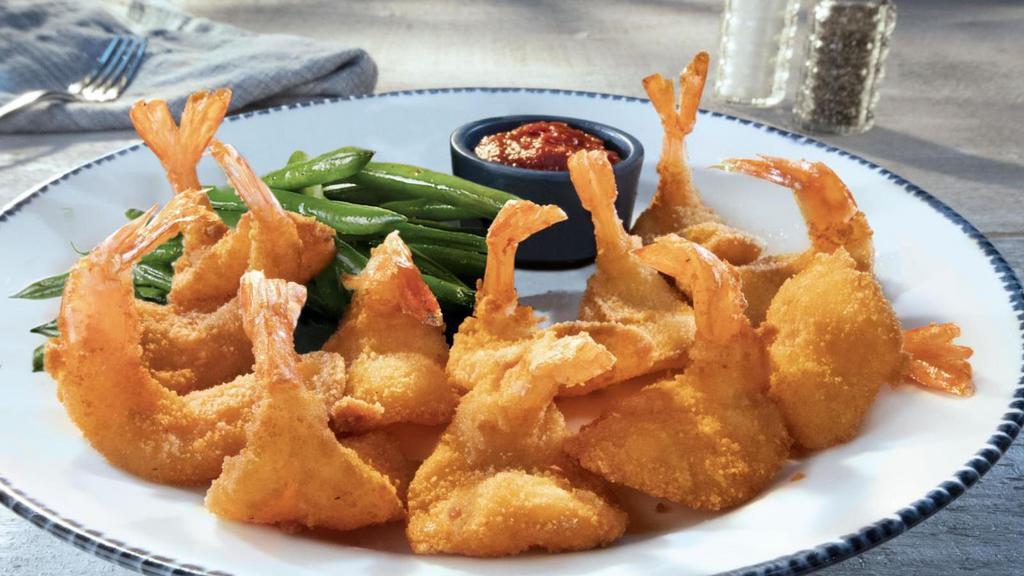 Walt'S Favorite Shrimp · Hand-breaded, butterflied and lightly fried—just the way Chef Walt liked them. Served with cocktail sauce and choice of sides.. 550 Cal
