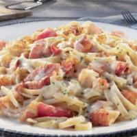 Lobster Linguini · Tender Maine lobster meat tossed with tomatoes and linguini in a creamy lobster sauce.. 1120...