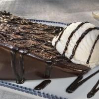 Chocolate Wave · Layers of warm, decadent chocolate cake and creamy fudge frosting. Served with vanilla ice c...