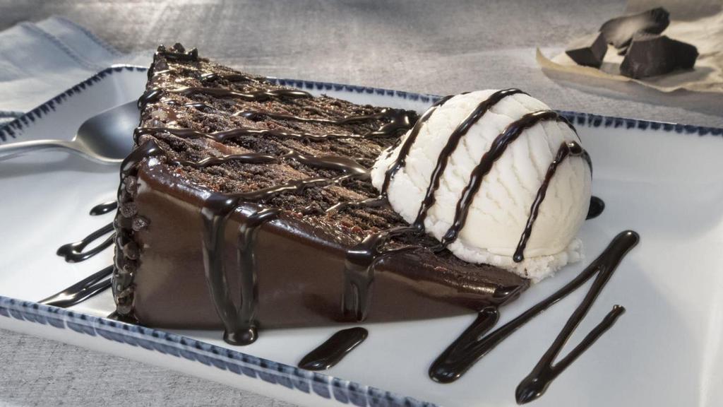 Chocolate Wave · Layers of warm, decadent chocolate cake and creamy fudge frosting. Served with vanilla ice cream and rich chocolate sauce.. 1110 Cal