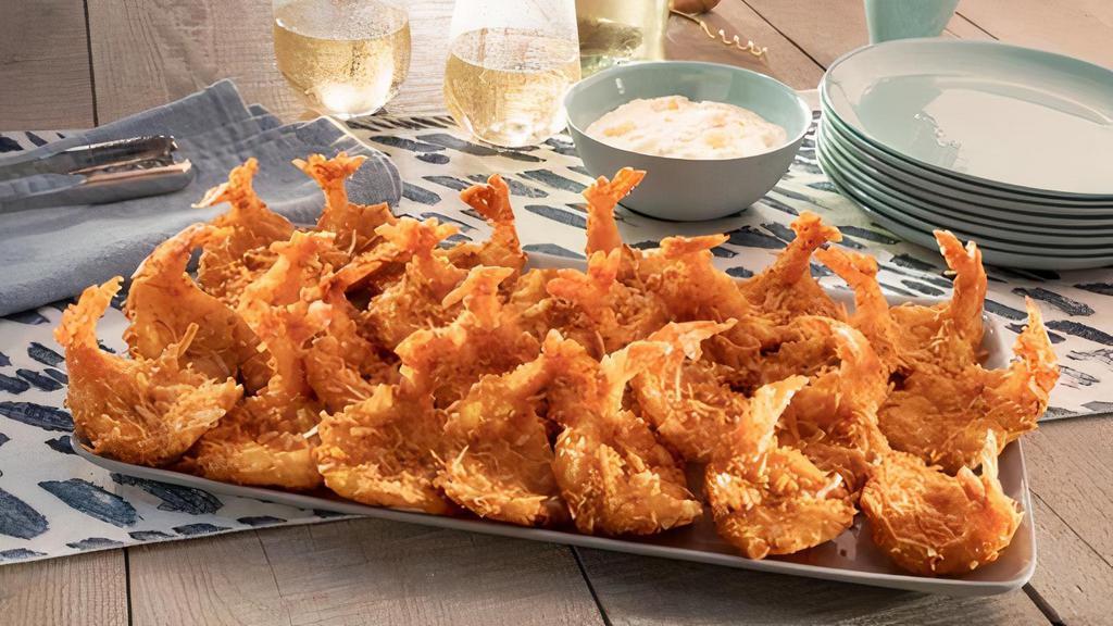 Parrot Isle Jumbo Coconut Shrimp Platter · Hand-dipped, tossed in flaky coconut and fried golden brown. Served with piña colada sauce.. 2870 Cal