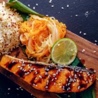 Salmon Teriyaki · Mouthwatering grilled Salmon topped with Teriyaki sauce and served with a side of rice and s...