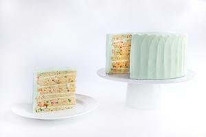 Celebration Cake · 6-layers of vanilla cake baked with colorful sugar confetti, filled & frosted with our signature retro-blue vanilla frosting.