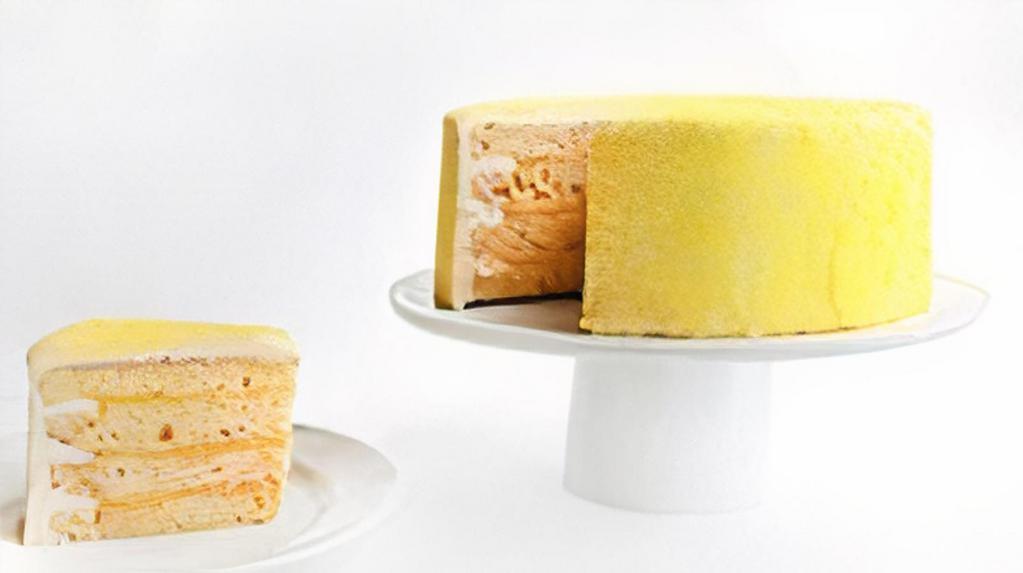 Luscious Lemon Cake · Four layers of vanilla cake filled with fresh lemon curd, frosted with vanilla buttercream.