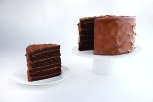 Old-Fashioned Chocolate Cake · “Just like you remember!” Towering high, moist chocolate cake filled and covered in rich, da...