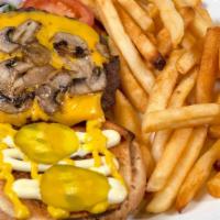 Grilled Mushroom Cheeseburger · Hearty angus beef patty with creamy cheese, and grilled mushrooms loaded onto toasted buns s...