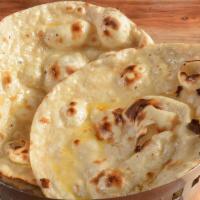 Butter Naan · Bread baked in a clay oven then brushed with butter.