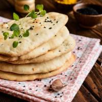 Garlic Naan · Bread baked in a clay oven with garlic.