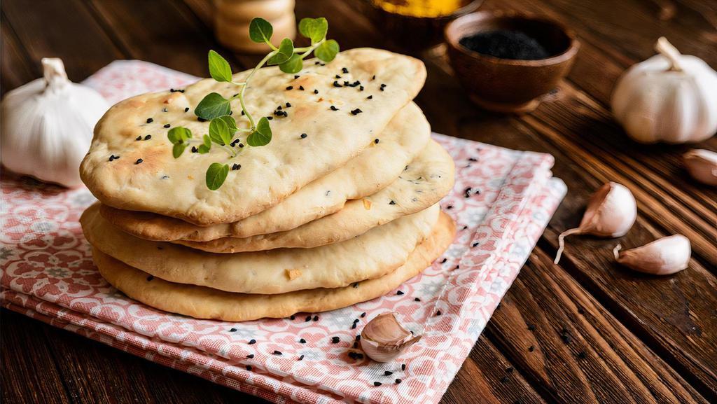 Garlic Naan · Bread baked in a clay oven with garlic.
