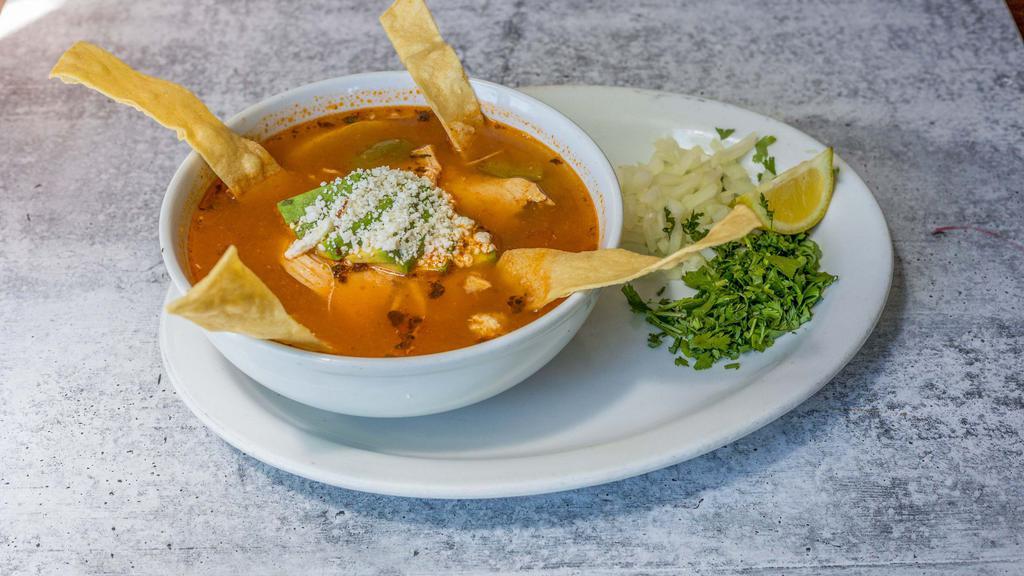 Sopa De Tortilla · Tortilla vegetable soup. Add chicken breast for an additional charge.