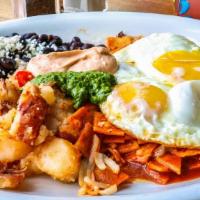 Chilaquiles · Corn tortilla chips cooked in a medium green tomatillo sauce or red spicy chile sauce, toppe...