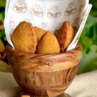 Empanada portion · Chicken (Coxinha) or Corn and Cheese (Risole) Empanadas. Each portion comes with 4 pieces.