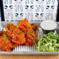 Buffalo Wings · A classic Buffalo wing.  All natural jumbo chicken wings, house blue cheese, romaine. *Pleas...