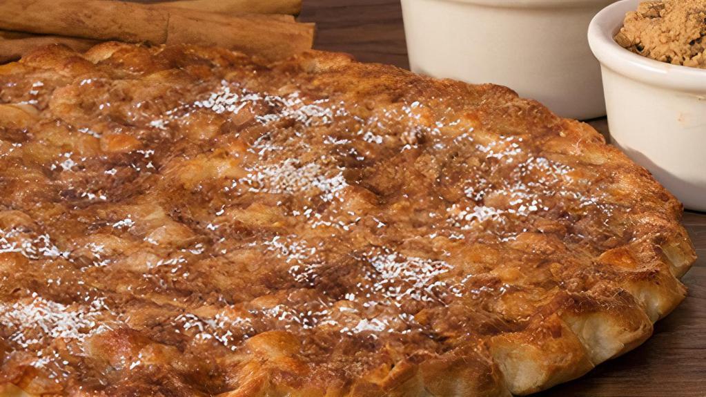 Cinnamon Dessert Pizza-MEDIUM · Our fresh pizza dough covered in butter, brown sugar, cinnamon and topped with a dusting of mozzarella and powdered sugar. - (230 cal./slice)