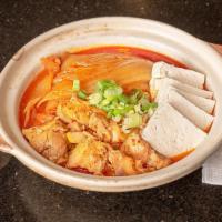 Kimchi Jjim / 김치찜 · Braised pork and aged kimchi. Served with rice and four side dishes.
