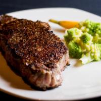 Prime New York Strip (14 oz.) · served with mashed potatoes