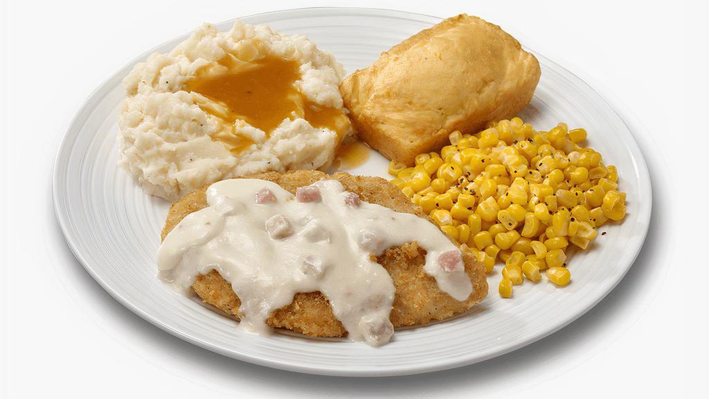 Cordon Bleu Crispy Chicken Meal · A crispy chicken breast topped with a creamy white wine sauce with Ham, Swiss cheese and a hint of Dijon Mustard.
