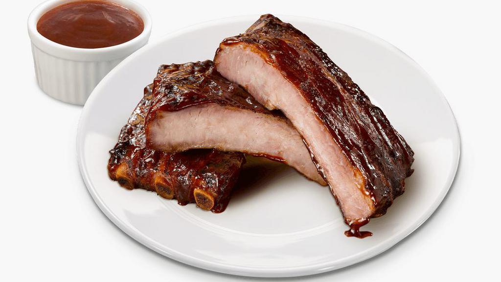 Baby Back Ribs · Savory, slow-cooked, and stick-to-your-ribs delicious. Our baby back ribs are dry-seasoned then brushed with a hickory-smoked BBQ sauce for meat so savory it falls off the bone.