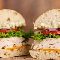 Chicken on Ciabatta · Simple and simply delicious. Rotisserie chicken with cheddar cheese, lettuce, tomato, red on...