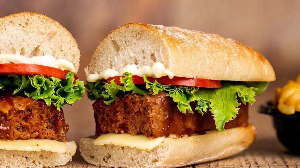 Meatloaf Sandwich · A real crave-able combination.  Rich, savory Meatloaf slices on a Ciabatta roll with zesty mayo, Pepper Jack cheese, lettuce and tomato.
