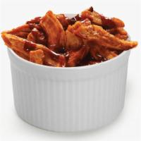Pulled BBQ Rotisserie Chicken · Hand-pulled rotisserie chicken tossed with our zesty BBQ sauce.