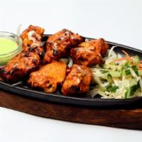 Sizzling Chicken Tikka Kebab · Perfect oven roasted chicken marinated in yogurt, lime juice and aromatic spices