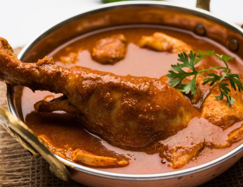 Traditional Chicken Curry · Delightful chicken stewed in onion tomato based sauce flavoured with ginger, garlic, pepper, cumin and other spices
