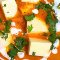 Creamy Paneer Butter Masala · Soft Paneer cubes cooked in smooth buttery and creamy tomato based gravy.