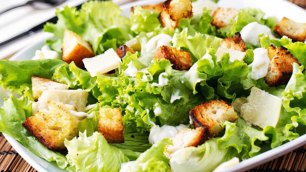 Ceaser Salad · Romaine lettuce tossed with parmesan cheese, seasoned.