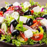 Greek Salad · Romaine hearts, tomatoes, cucumber, red onions, feta cheese.