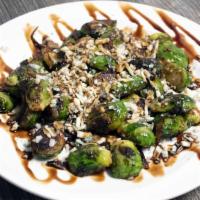 Sautéed Brussel · Sprouts with gorgonzola cheese, onions, and balsamic reduction.